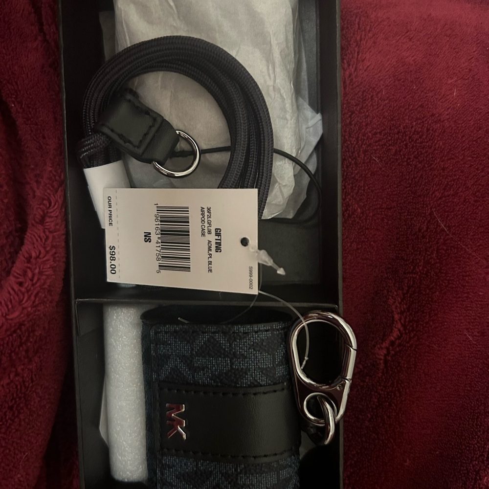 MK air pods 2 pro case with keychain and lanyard attachment.